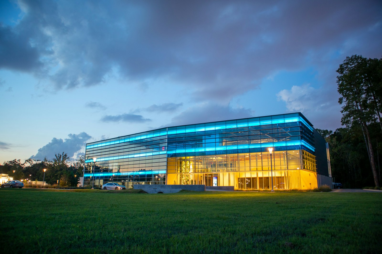 Glass building lit at dusk
