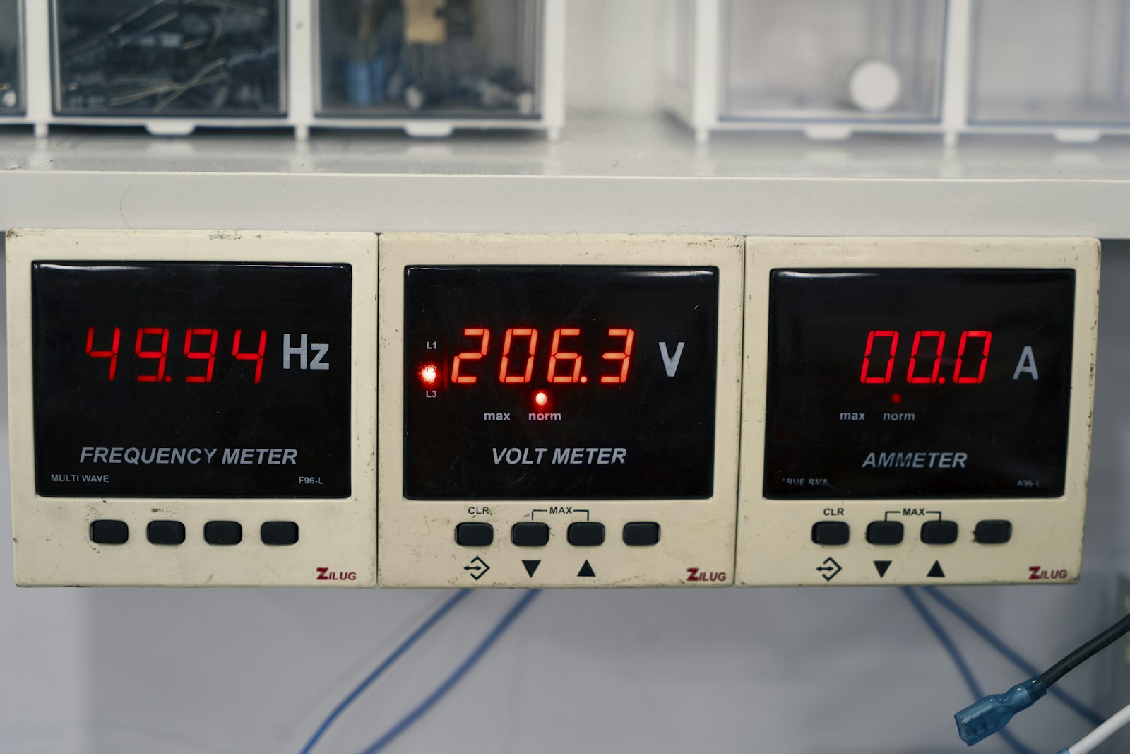 Panel meters showing frequency, voltage and current