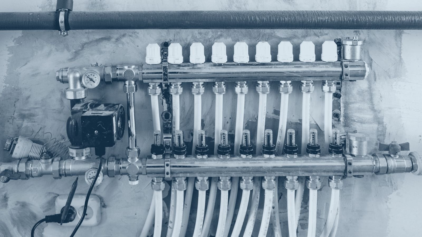 An industrial manifold carrying pressure gauges and steel pipework
