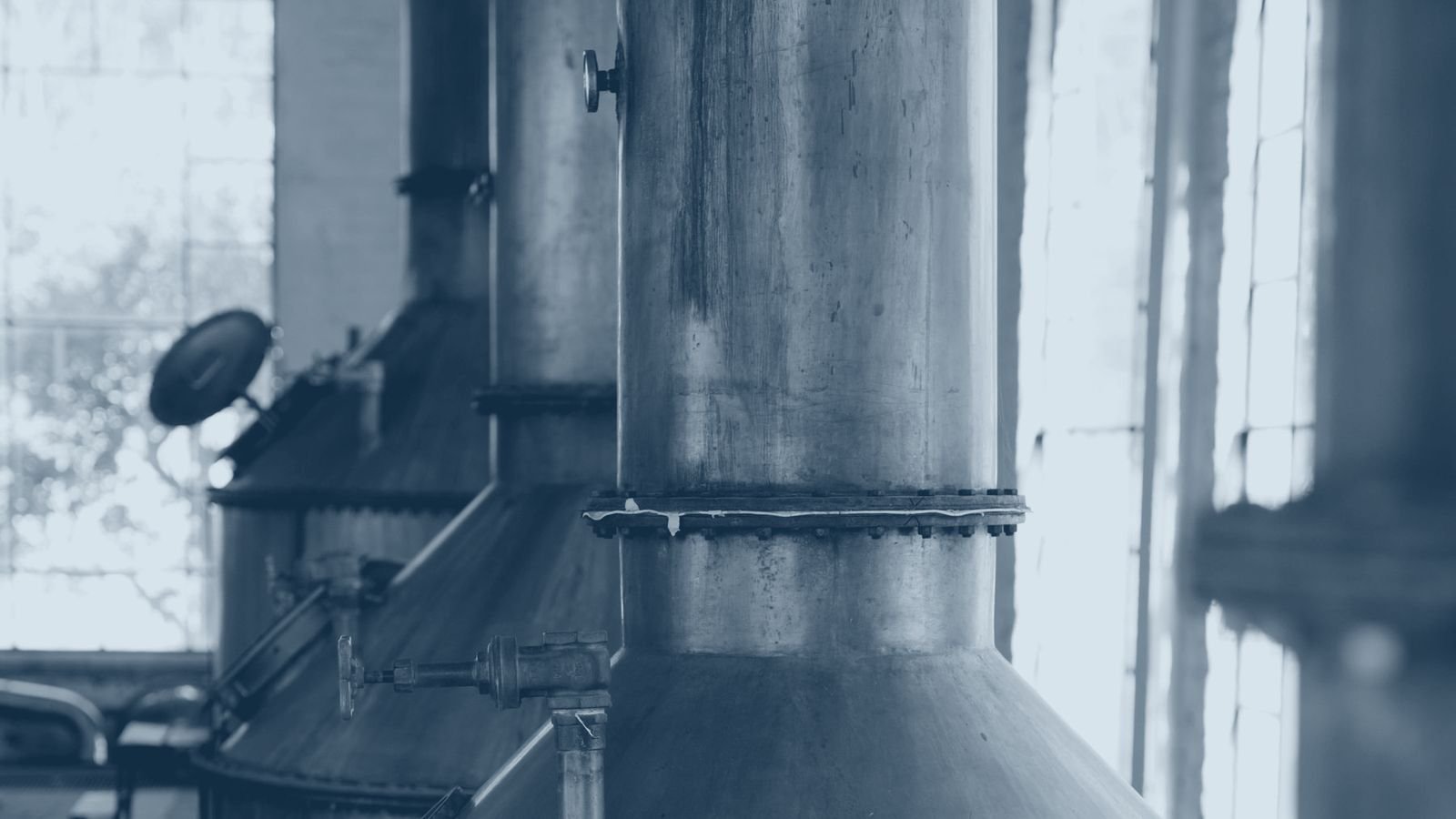 A copper pot still in a working distillery