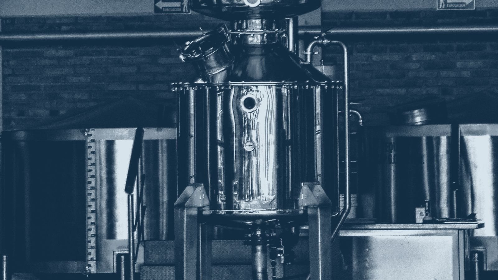 Stainless steel tanks and pipework in a distillery